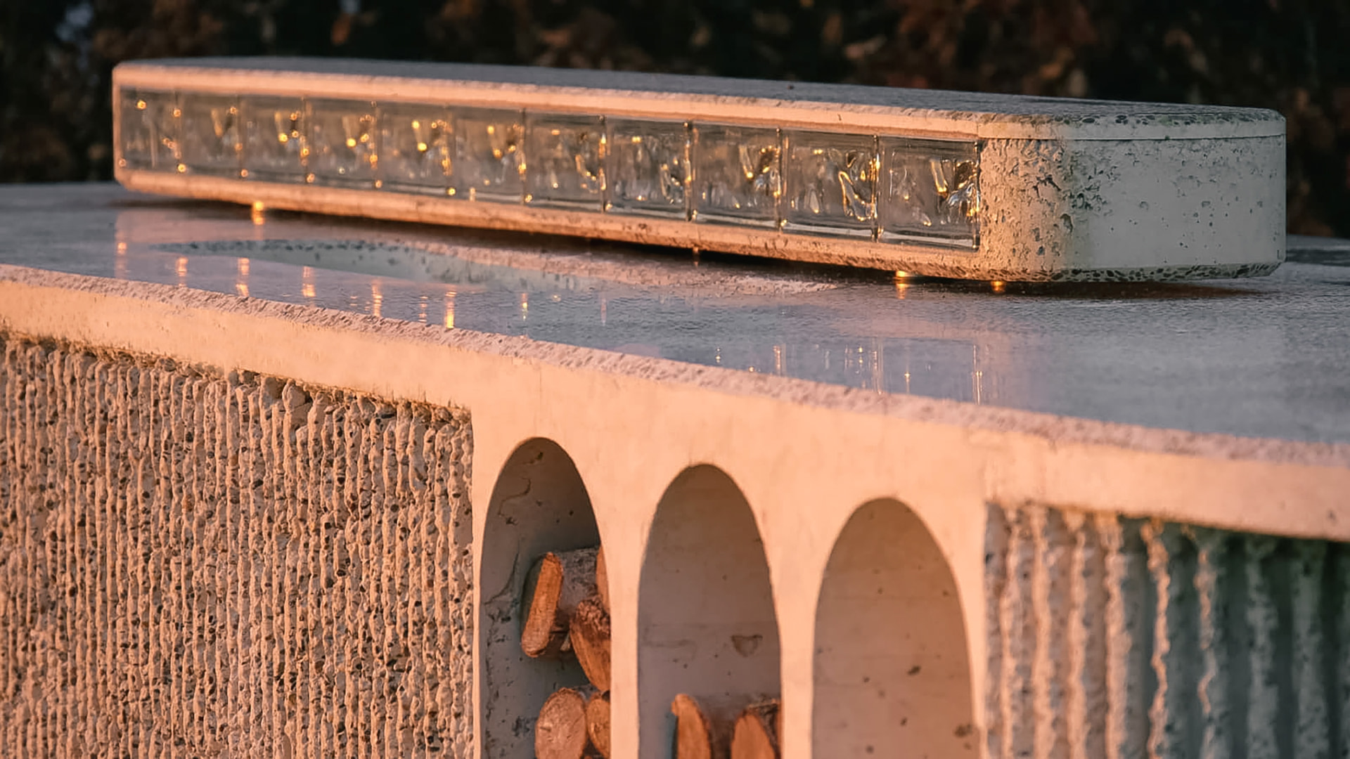 Cast concrete outdoor kitchen at golden hour